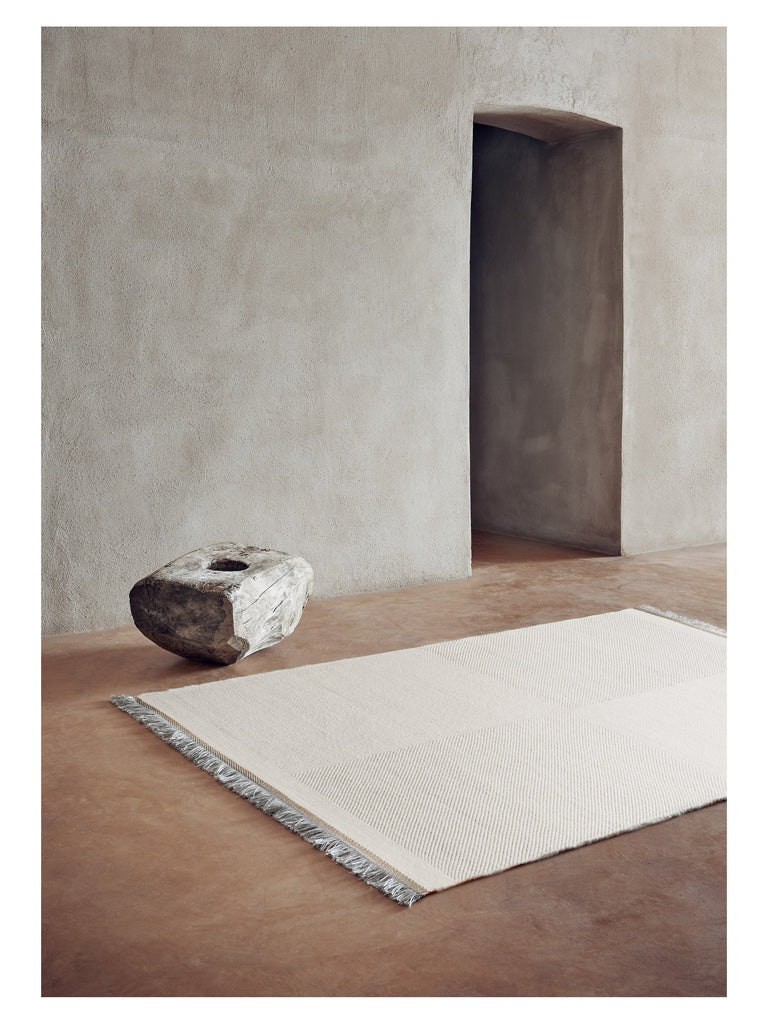 Mattia White hand-woven rug – styled in a living room | Linie Design at Bois Blanc Home, Limassol, Cyprus