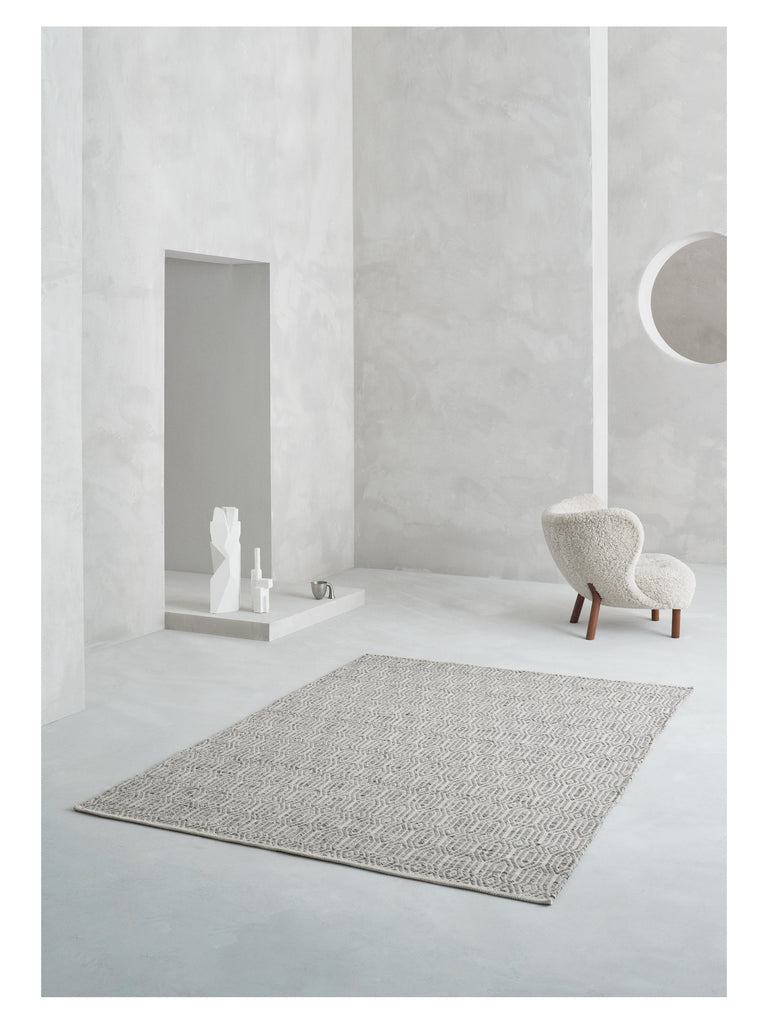 Justin Grey hand-woven rug – styled in a living room | Linie Design at Bois Blanc Home, Limassol, Cyprus