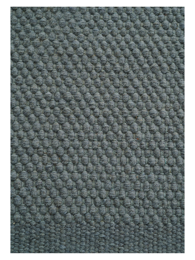 Oksa Moss hand-woven rug – close-up of the texture | Linie Design at Bois Blanc Home, Limassol, Cyprus