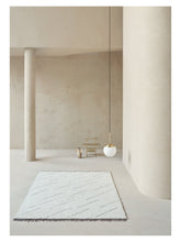 Laden Sie das Bild in den Galerie-Viewer, Torun Earth hand-knotted rug – styled in a living room | Linie Design at Bois Blanc Home, Limassol, Cyprus