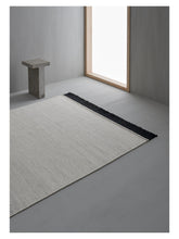 Laden Sie das Bild in den Galerie-Viewer, Fenja White hand-woven rug – styled in a living room | Linie Design at Bois Blanc Home, Limassol, Cyprus