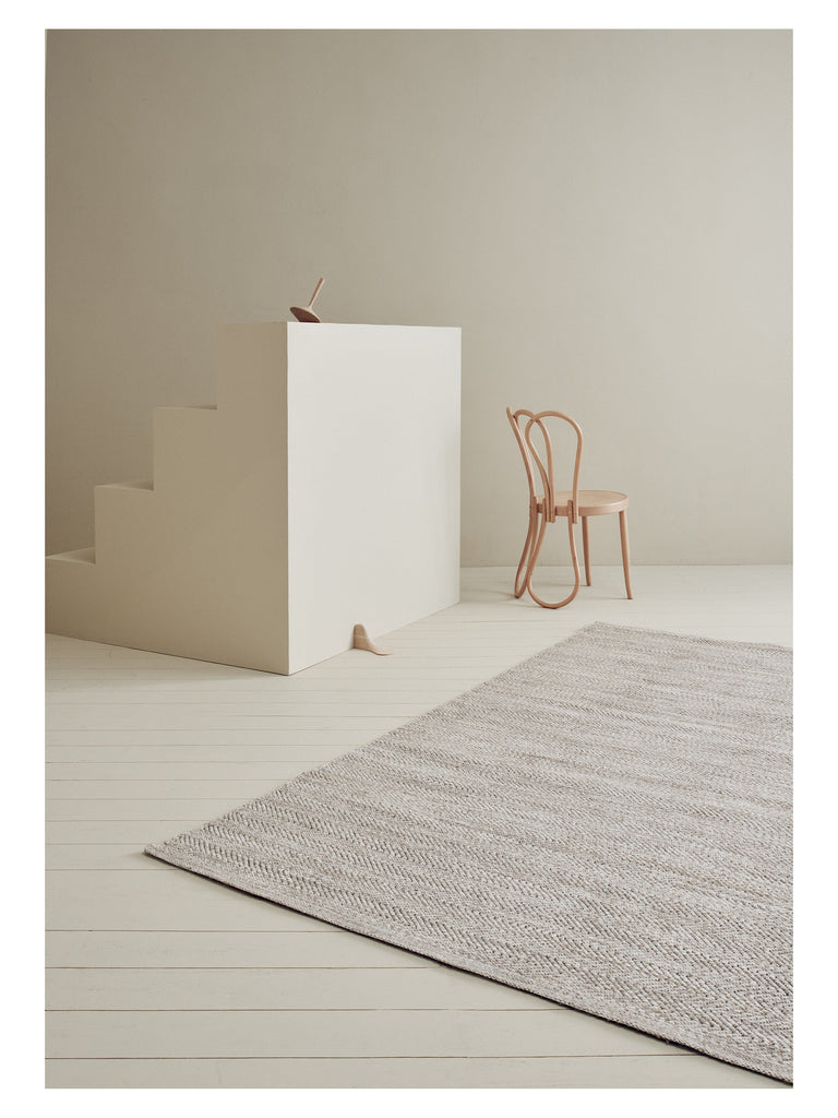 Lia Anthracite hand-woven rug – styled in a living room | Linie Design at Bois Blanc Home, Limassol, Cyprus