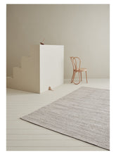 Laden Sie das Bild in den Galerie-Viewer, Lia Anthracite hand-woven rug – styled in a living room | Linie Design at Bois Blanc Home, Limassol, Cyprus