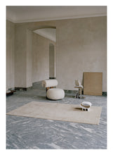 Laden Sie das Bild in den Galerie-Viewer, Cursive Expanse Beige loom-knotted rug – styled in a living room | Linie Design at Bois Blanc Home, Limassol, Cyprus