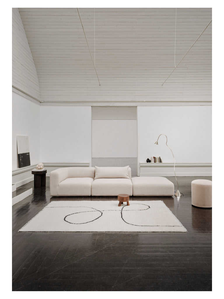 Astral Spiral Black hand-knotted rug – styled in a living room | Linie Design at Bois Blanc Home, Limassol, Cyprus