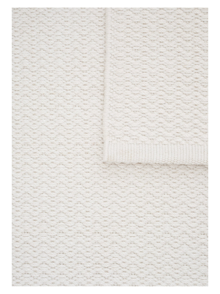 Helix Haven White hand-woven rug – close-up of the texture | Linie Design at Bois Blanc Home, Limassol, Cyprus