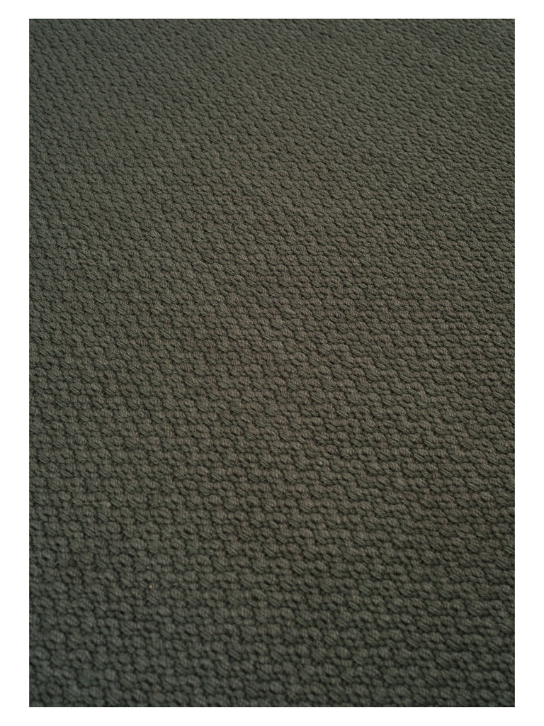 Helix Haven Green hand-woven rug – close-up of the texture | Linie Design at Bois Blanc Home, Limassol, Cyprus