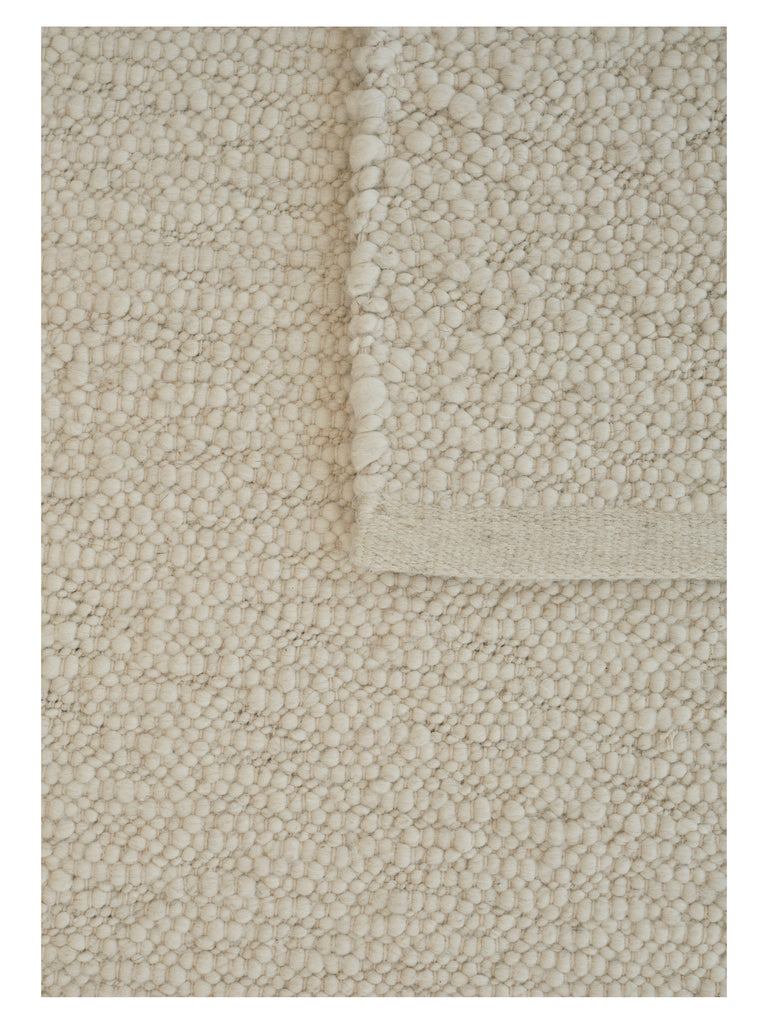 Pebbled Poem White hand-woven rug | Linie Design at Bois Blanc Home, Limassol, Cyprus