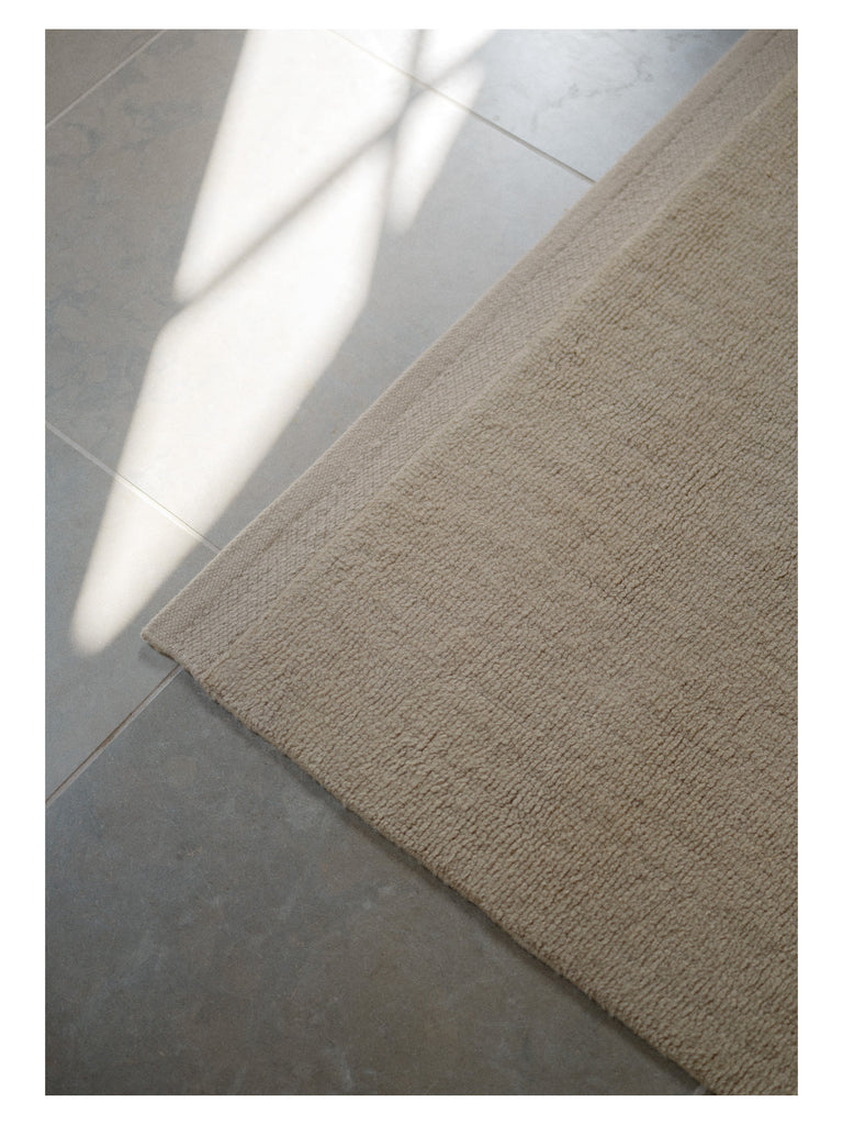 Hushed Frame Beige table-tuft rug – styled in a living room | Linie Design at Bois Blanc Home, Limassol, Cyprus