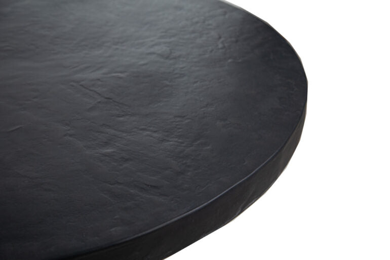 Black round concrete table